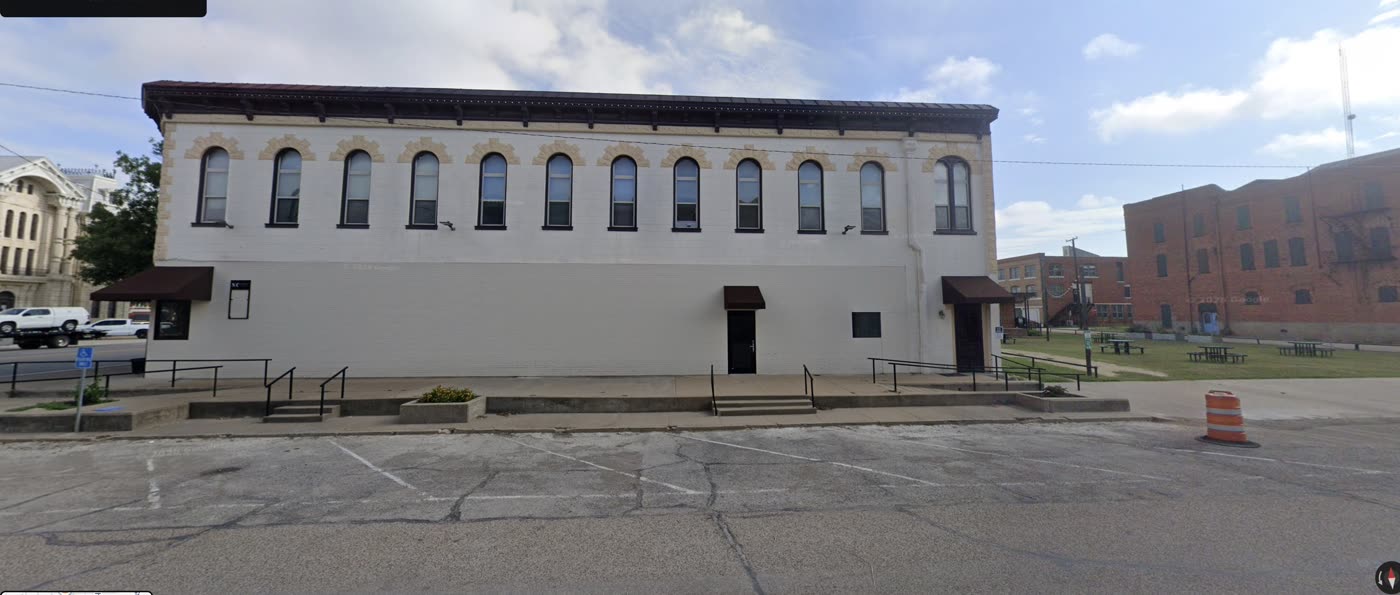 100 East Elm, south wall, courthouse to the left