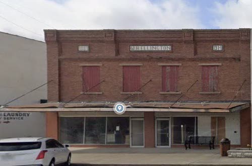 114 and 116 East Elm, Johnson Cleaners brick building