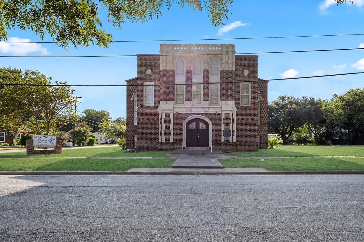 100 Craig Street listing photo, three-story brick church